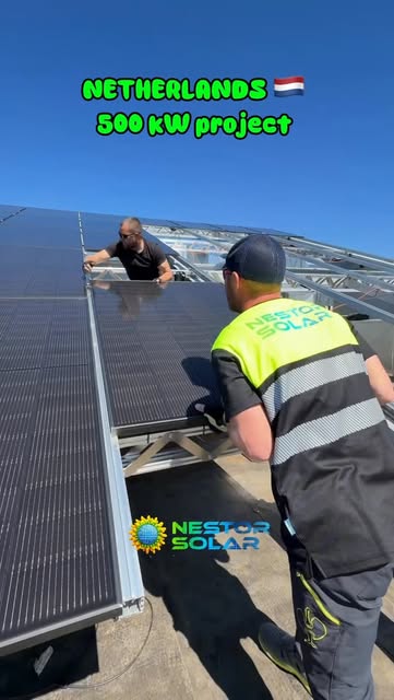 Nestor Solar installer handling a solar module on a Netherlands rooftop project
