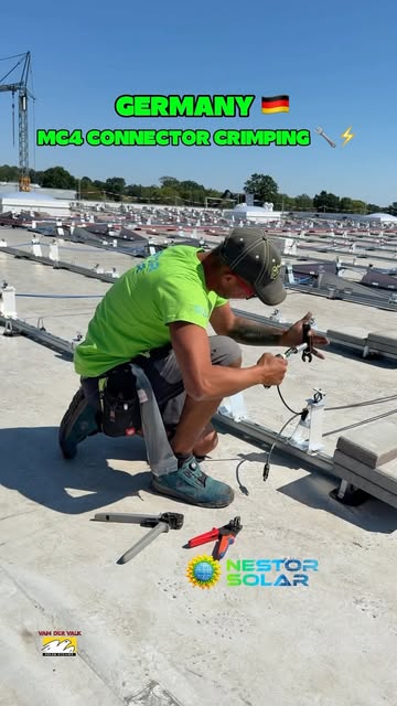 Nestor Solar installer crimping an MC4 connector on a German rooftop